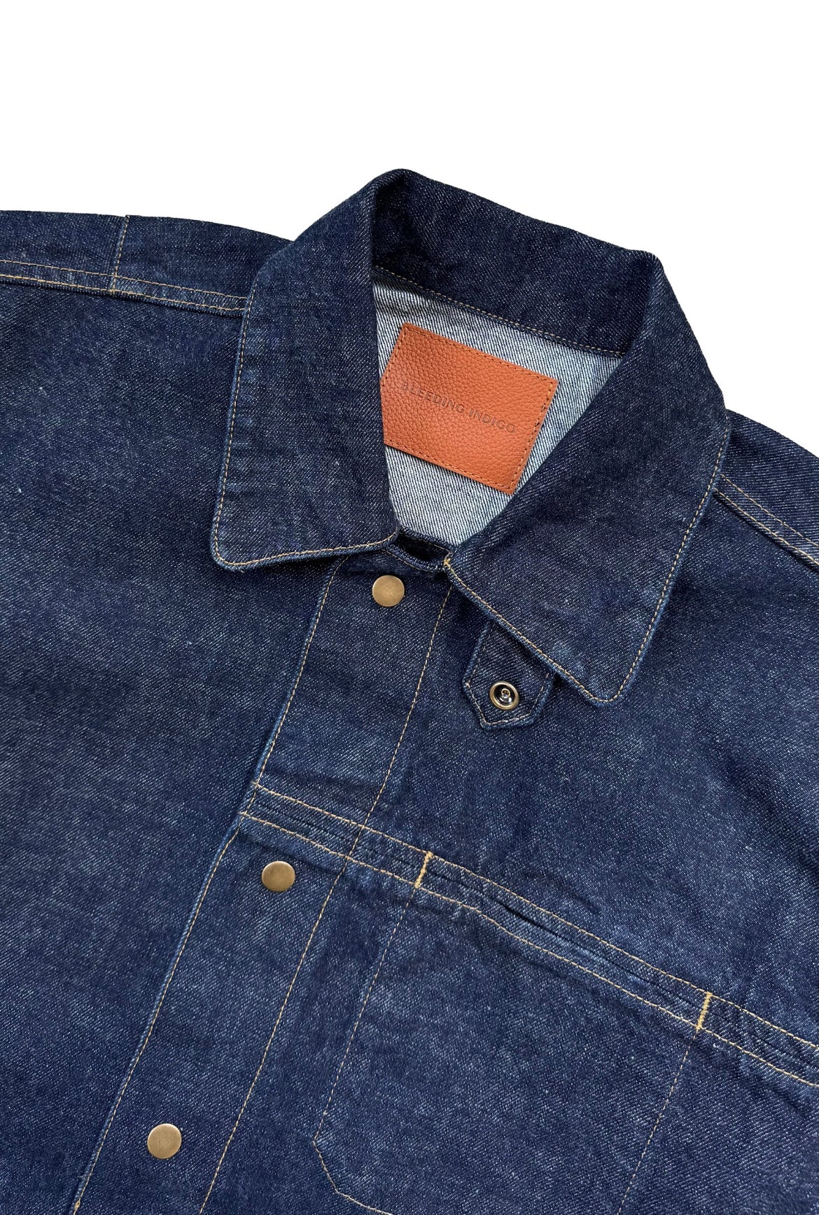Close up of Oliver Chore Jacket label on white background