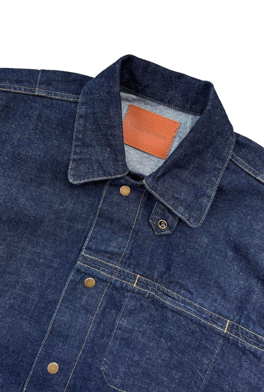 Close up of Oliver Chore Jacket label on white background