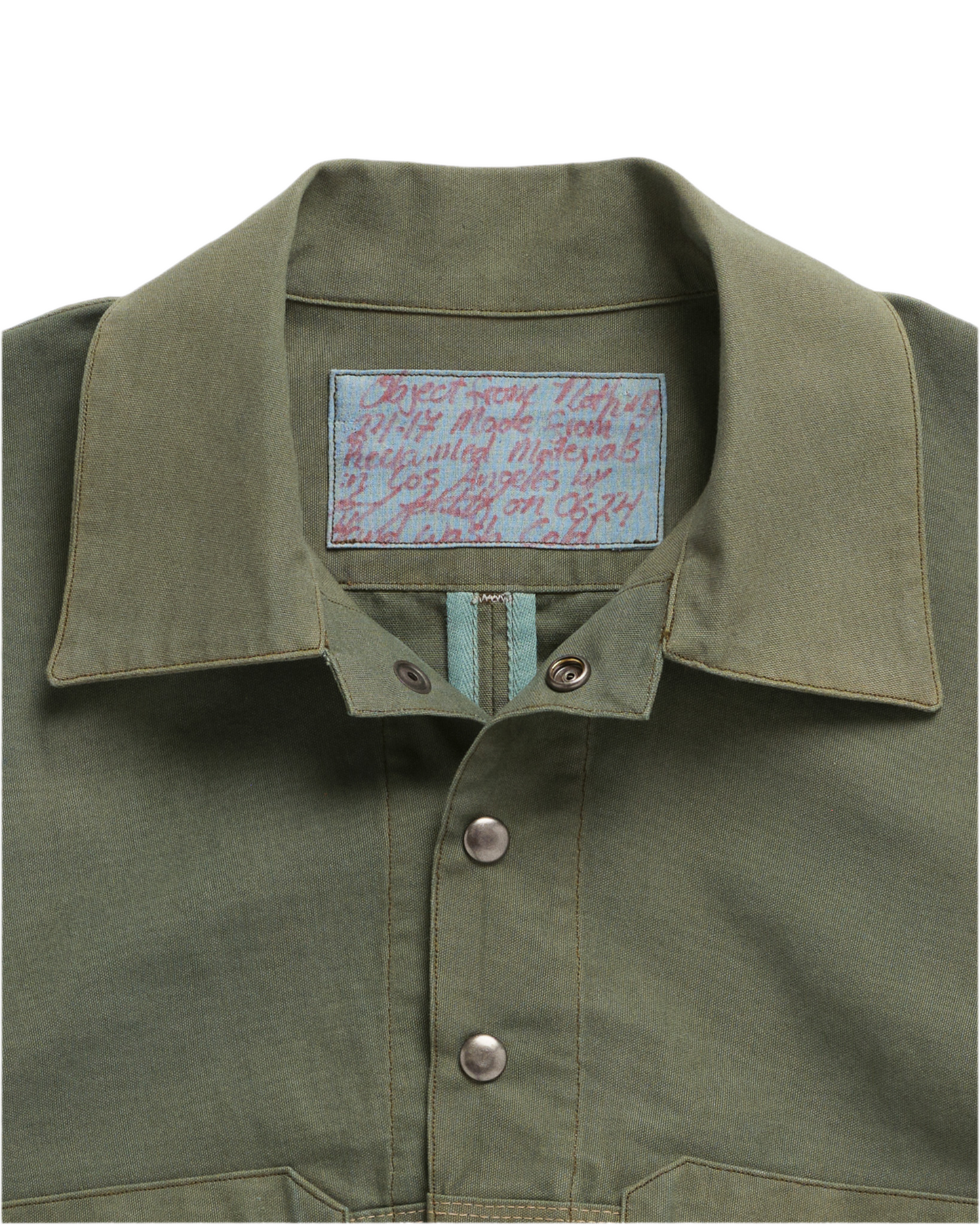 Close up on Object from Nothing label on the Green Vented Canvas Jacket