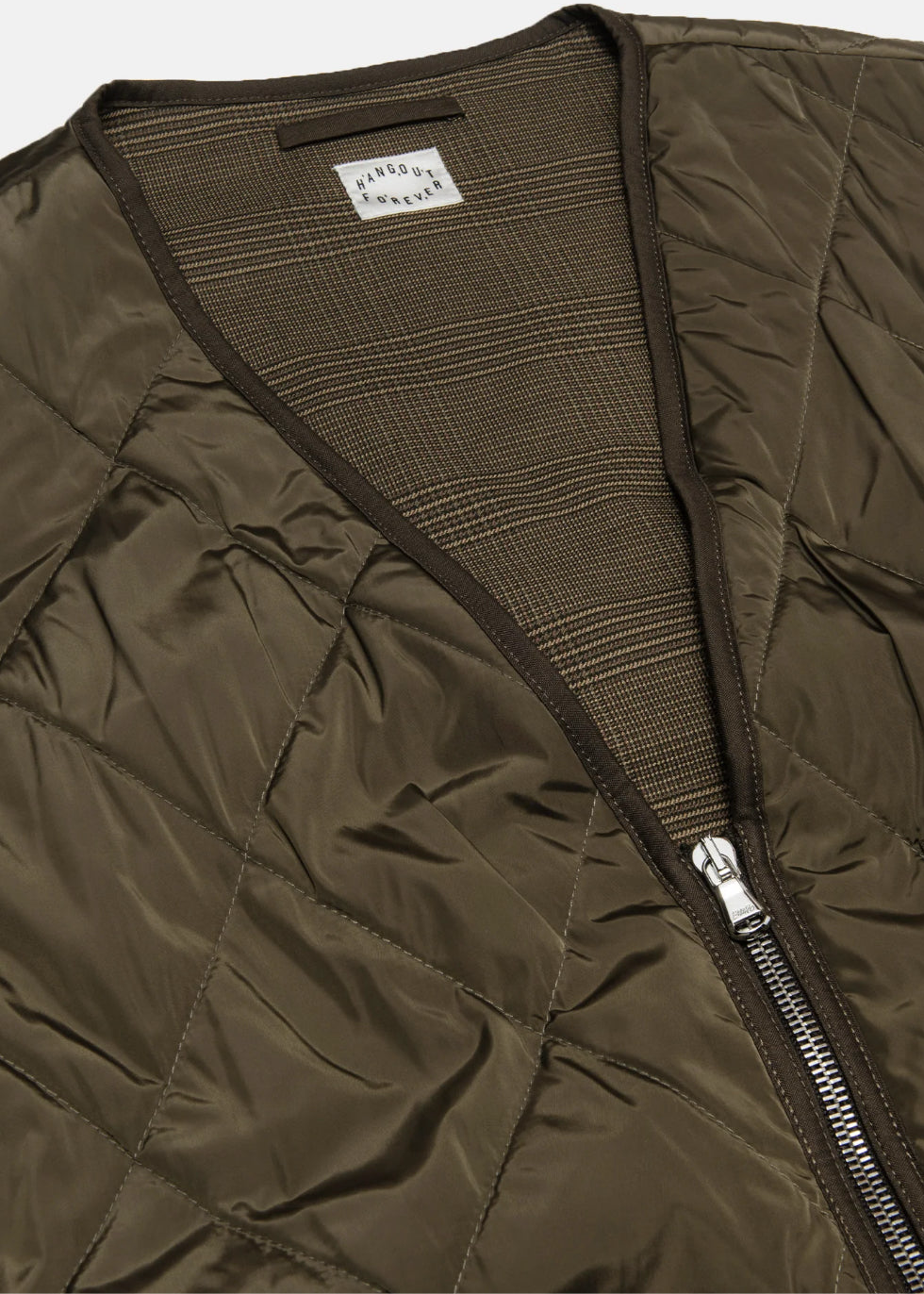 Closeup of Hangout Forever’s Bark Quilted Tech Studio Vest on a white background