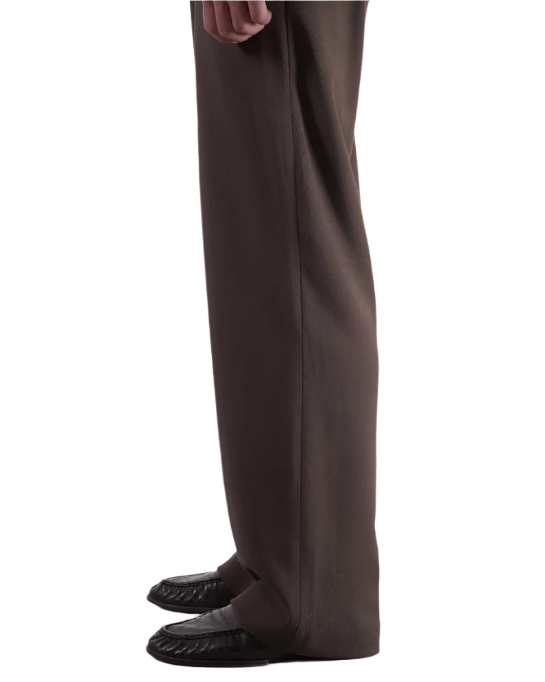 Side of Walnut Lewis Trousers worn by a model on a white background 