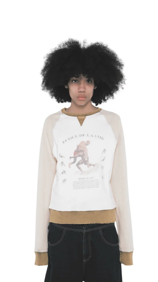 Shot of a model wearing the Scapegrace Laamb Crewneck in Sand Yellow