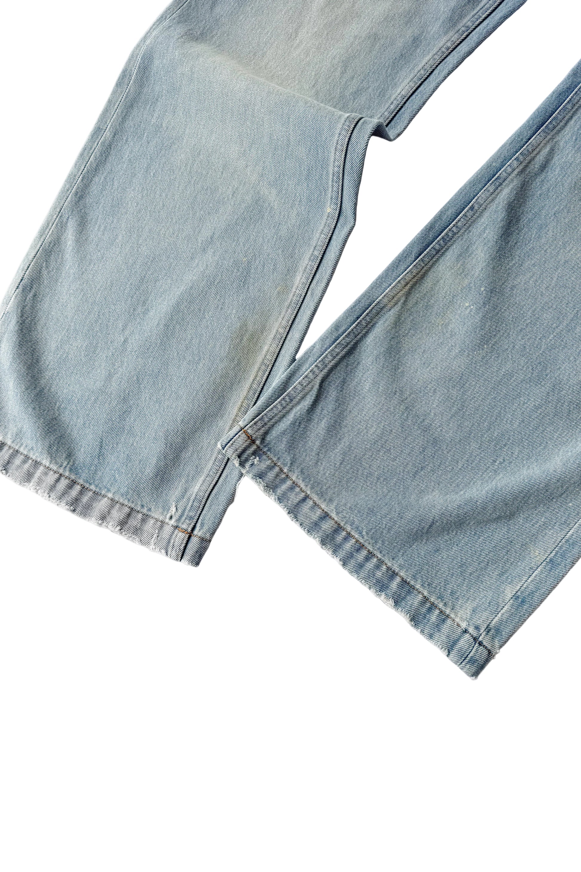 Close-up of a light blue denim jacket on a white background